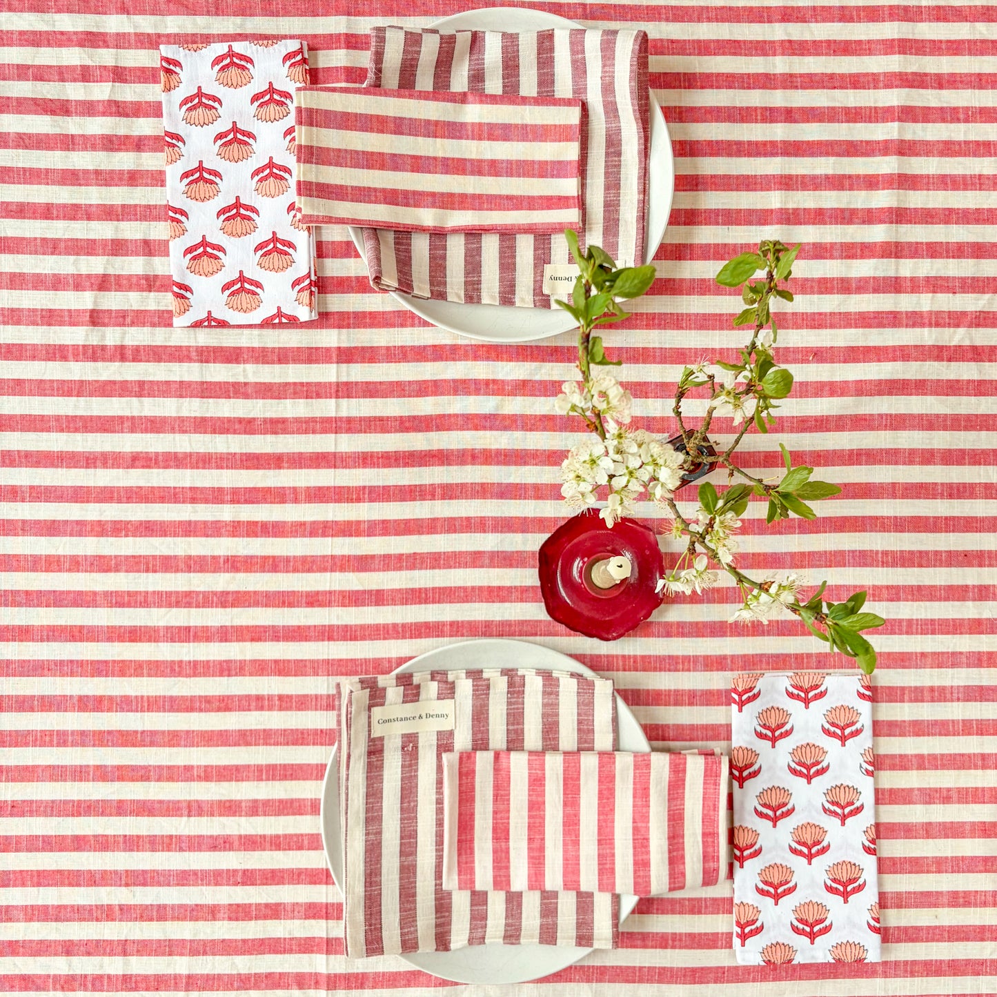 Red and white striped fabric with floral patterns on a matching background