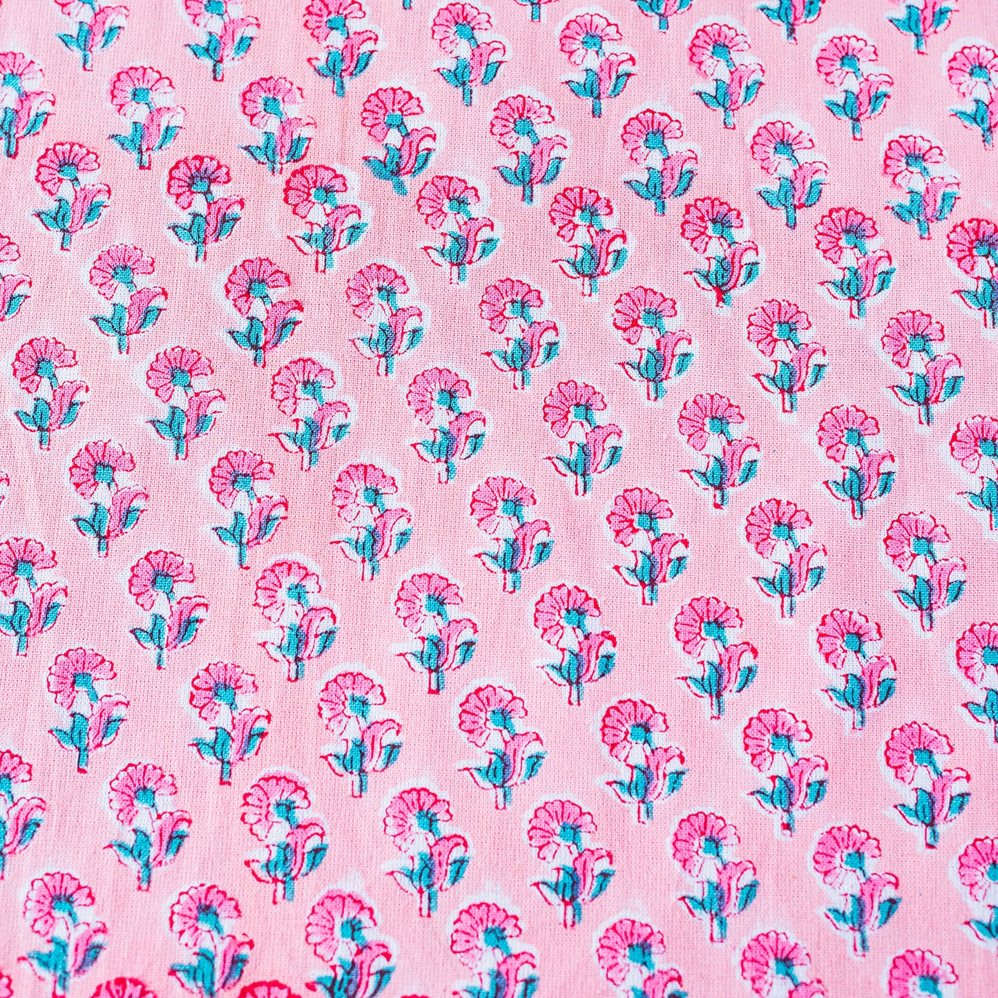 Pattern of pink and blue flowers on a pink background