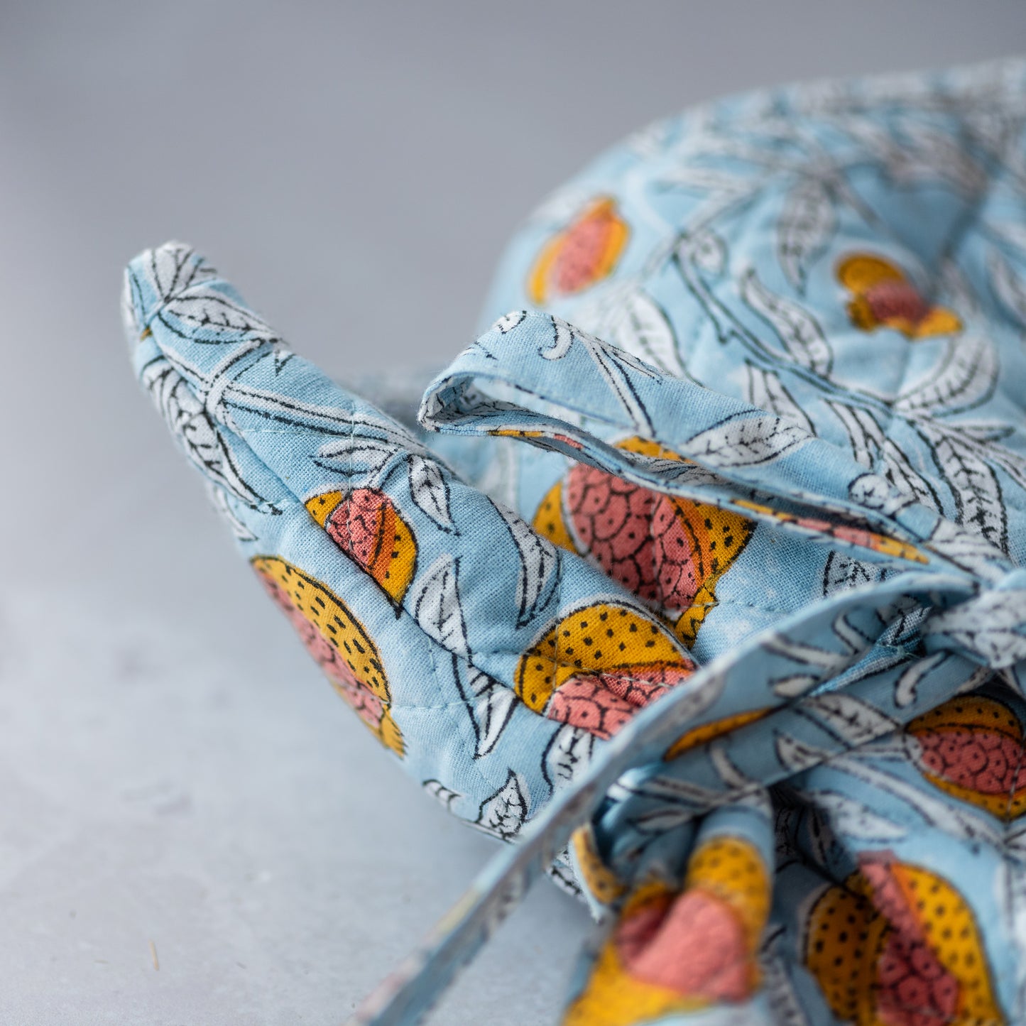 constance-and-denny-hot-water-bottle-pomegranate-cosy-block-printed-detail