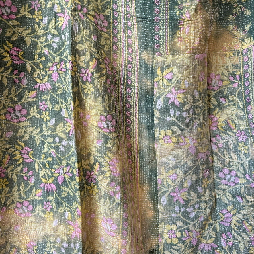 Floral patterned fabric with green, pink, and yellow colors.