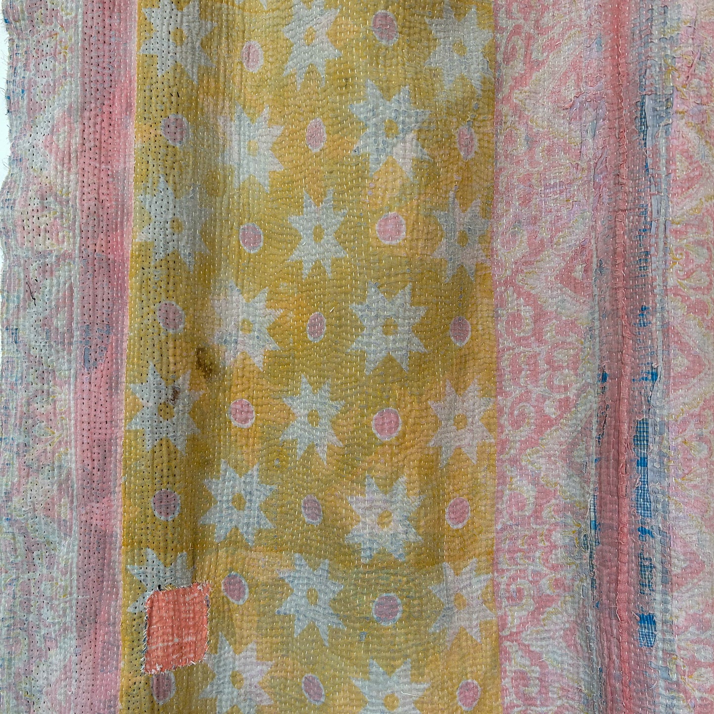 Textile with a floral pattern on a yellow background