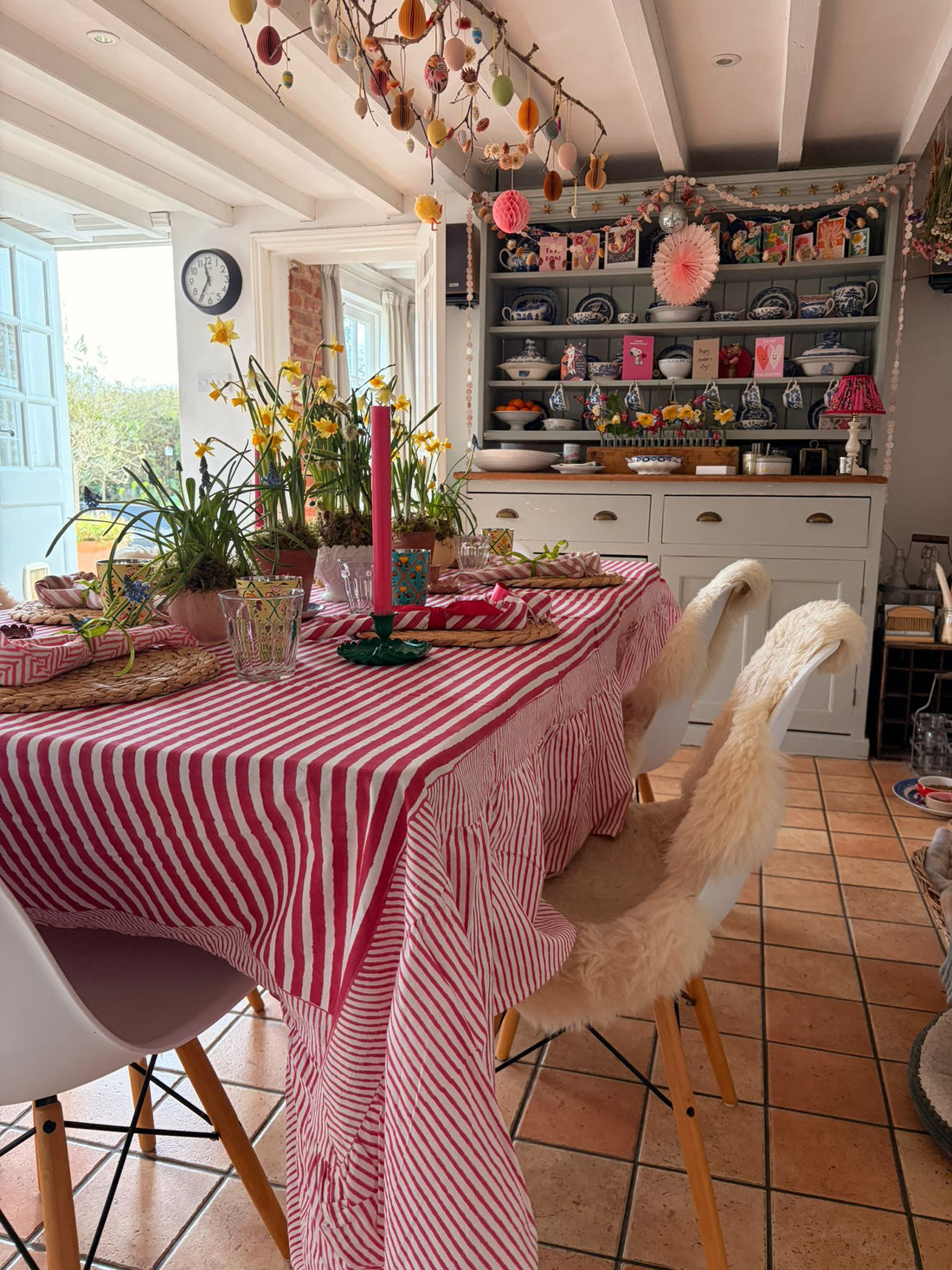 spring table set with striped tablecloth and florals