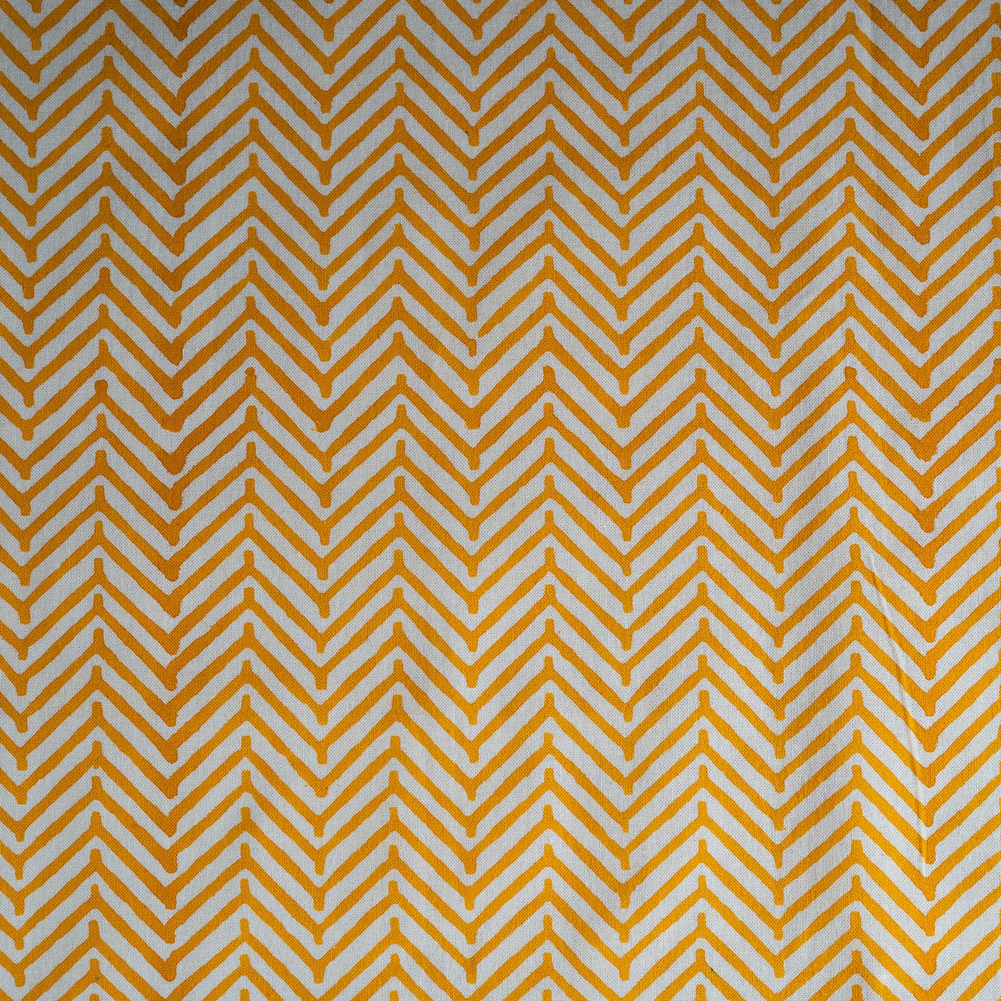Pattern of yellow chevrons on a white background