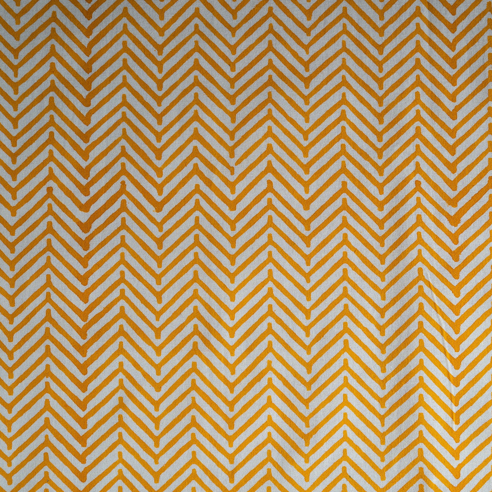 Pattern of yellow chevrons on a white background