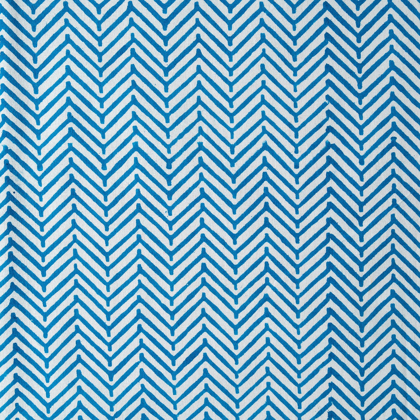 Blue and white chevron pattern on a textured background