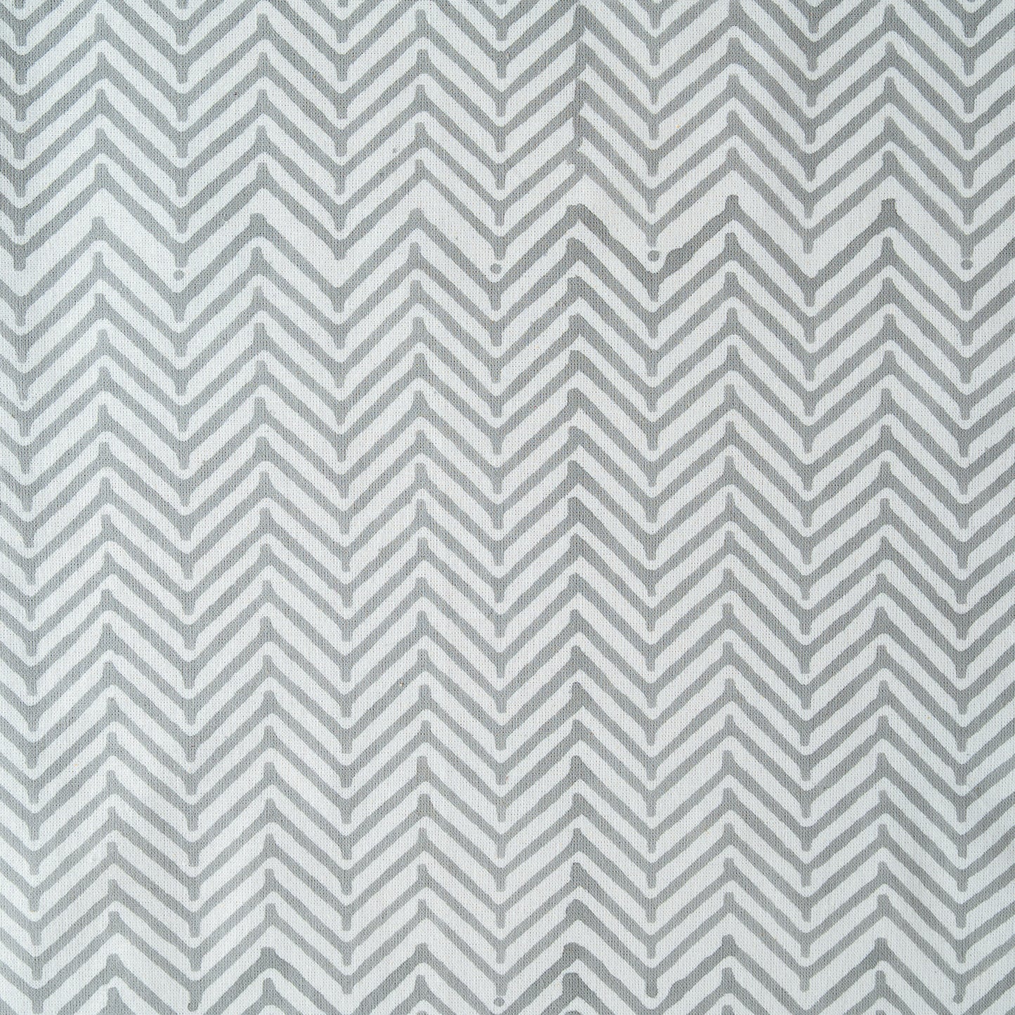 Gray and white chevron pattern on a textured background