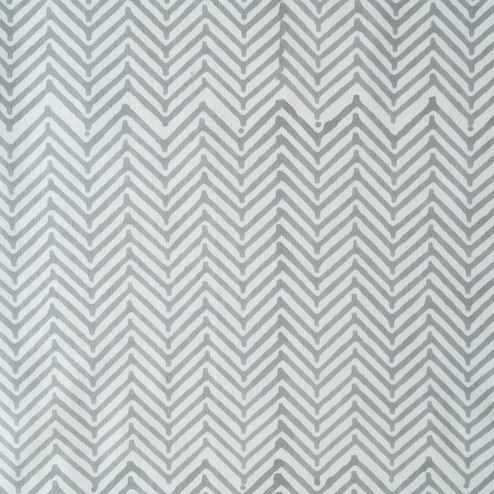 Gray and white chevron pattern on a textured background