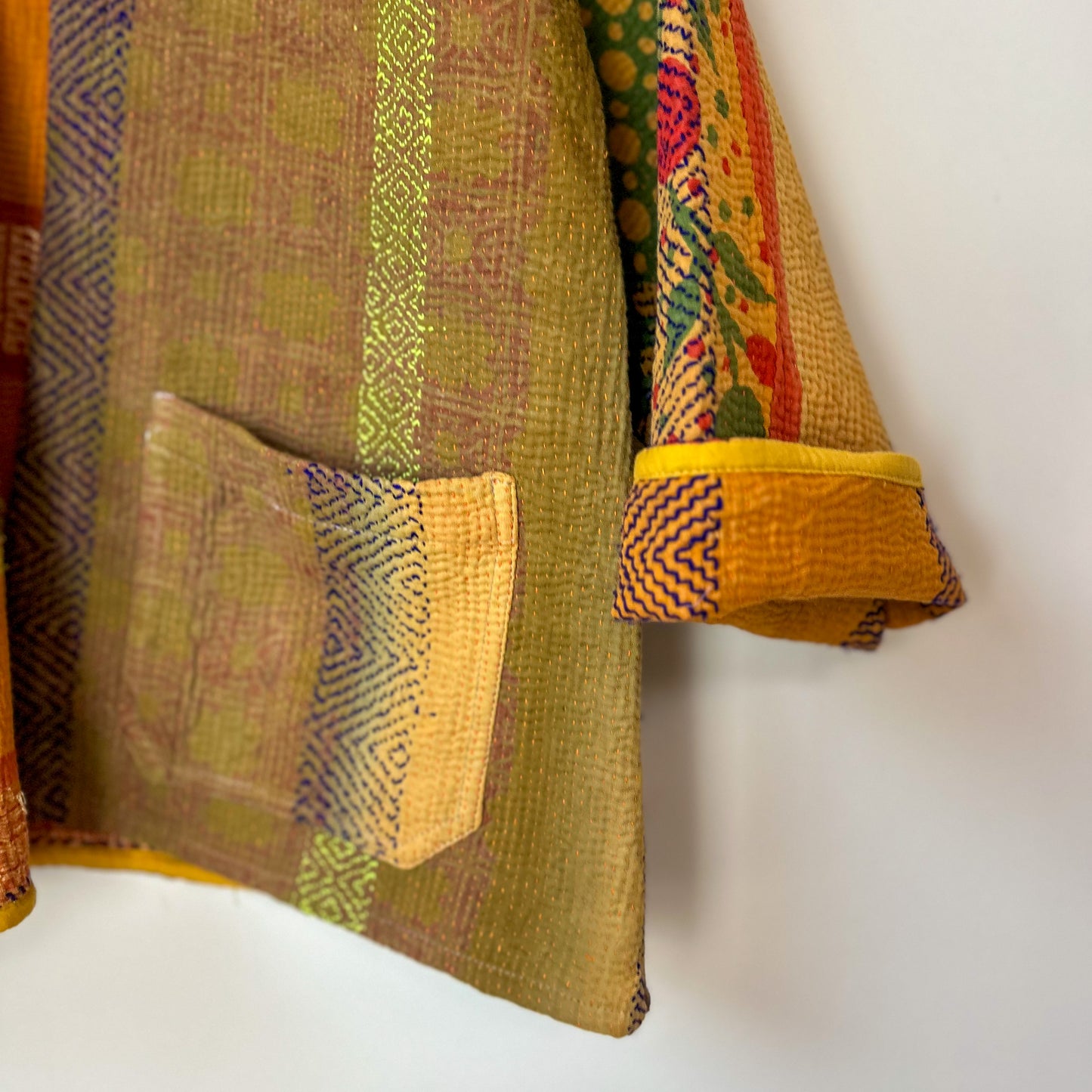 Colorful kantha fabric with geometric patterns on a white background. Vintage-kantha-jacket-handmade-unique-35
