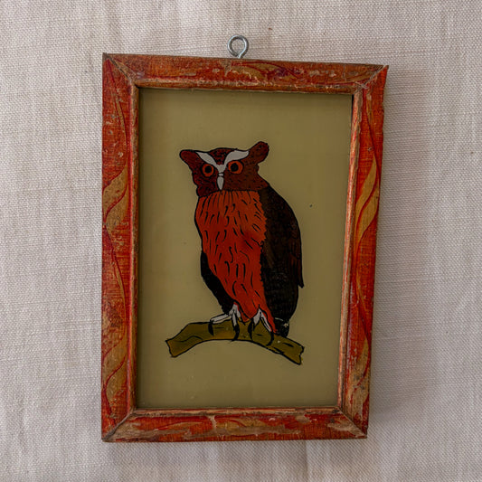 Framed artwork of an owl on a textured beige background