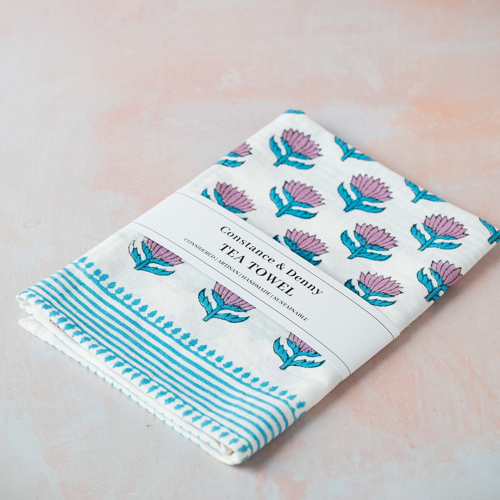 Tea towel with floral design on a light background