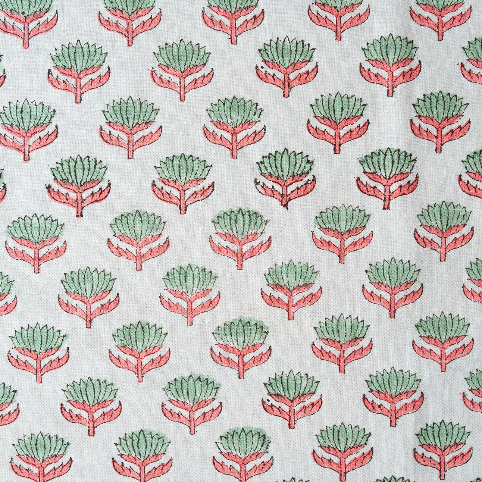 Pattern of green and red abstract shapes on a white background