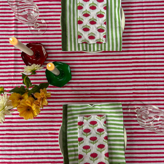 Hand block printed cotton tablecloth in joyful red stripes with a floral border — ethically made, colourful, and perfect for every gathering.