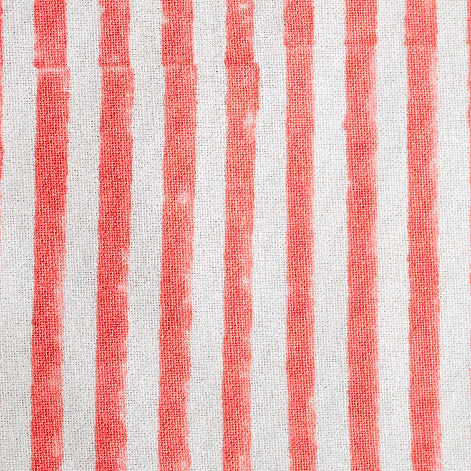 Close-up of fabric with red and white vertical stripes.