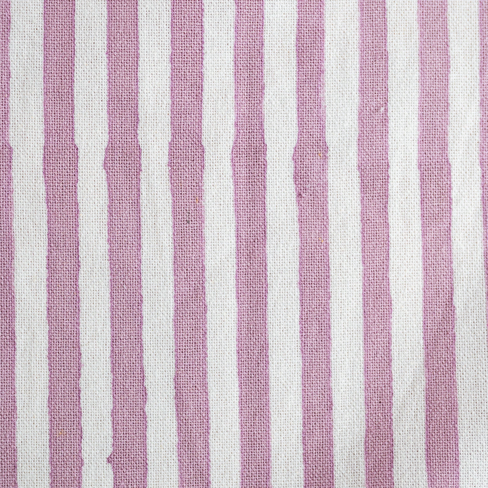 Fabric with pink and white vertical stripes