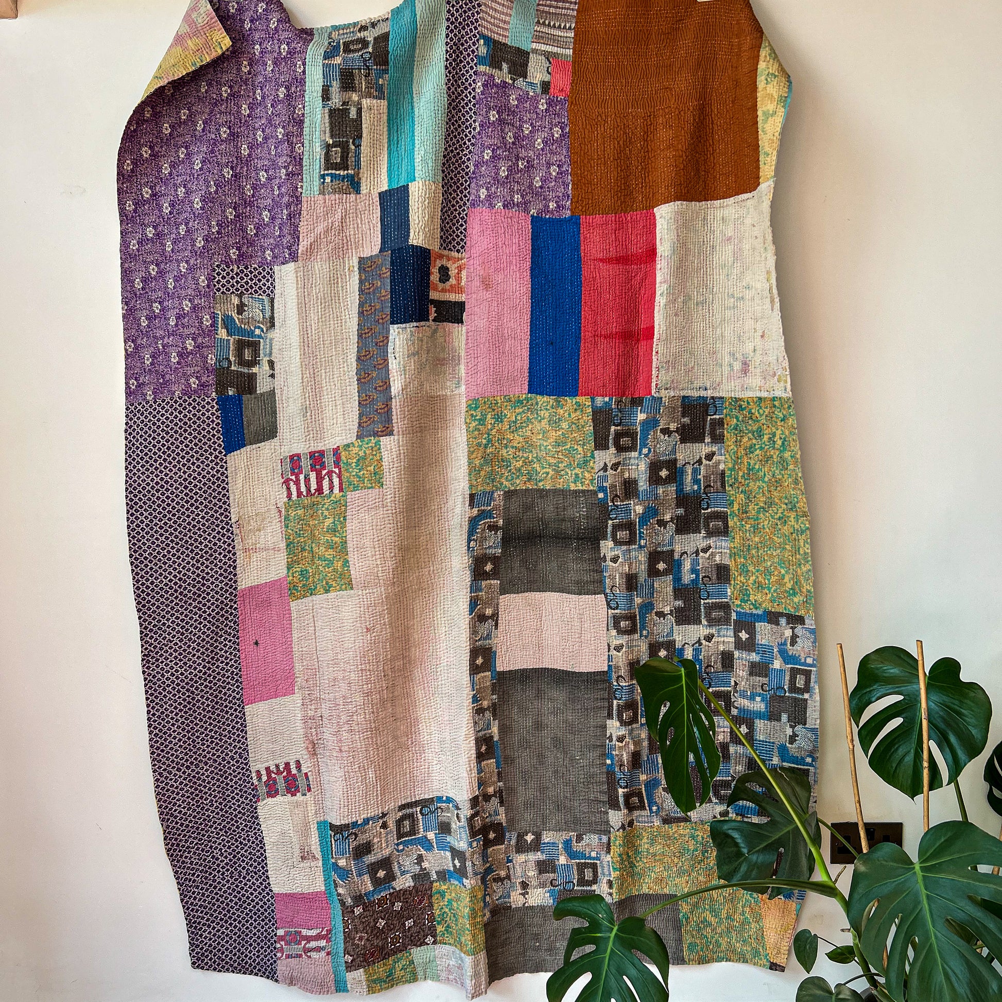 Patchwork quilt with multicolored squares on a white background. Vintage-kantha-2019-A-blanket-throw