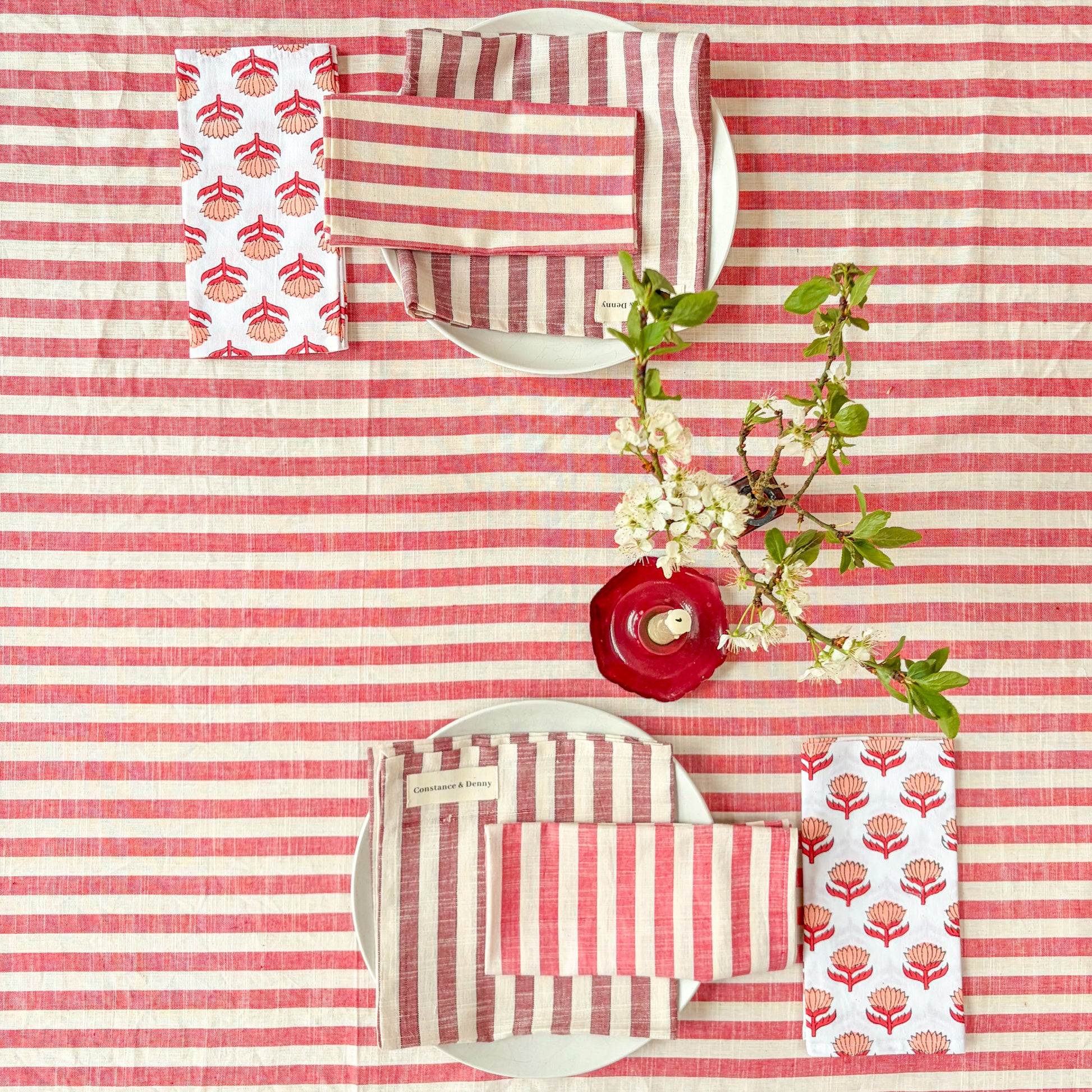 Red and white striped fabric with floral patterns on a matching background