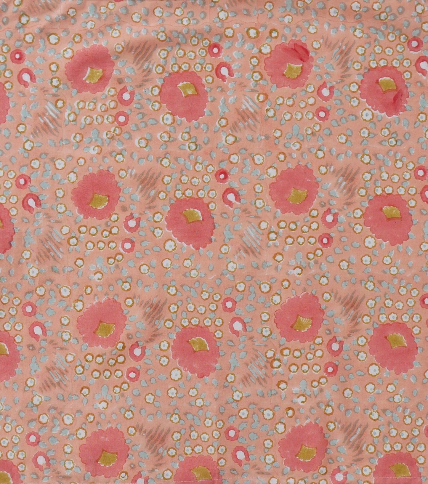 Patterned napkins with pink flowers and small white dots on a light pink background