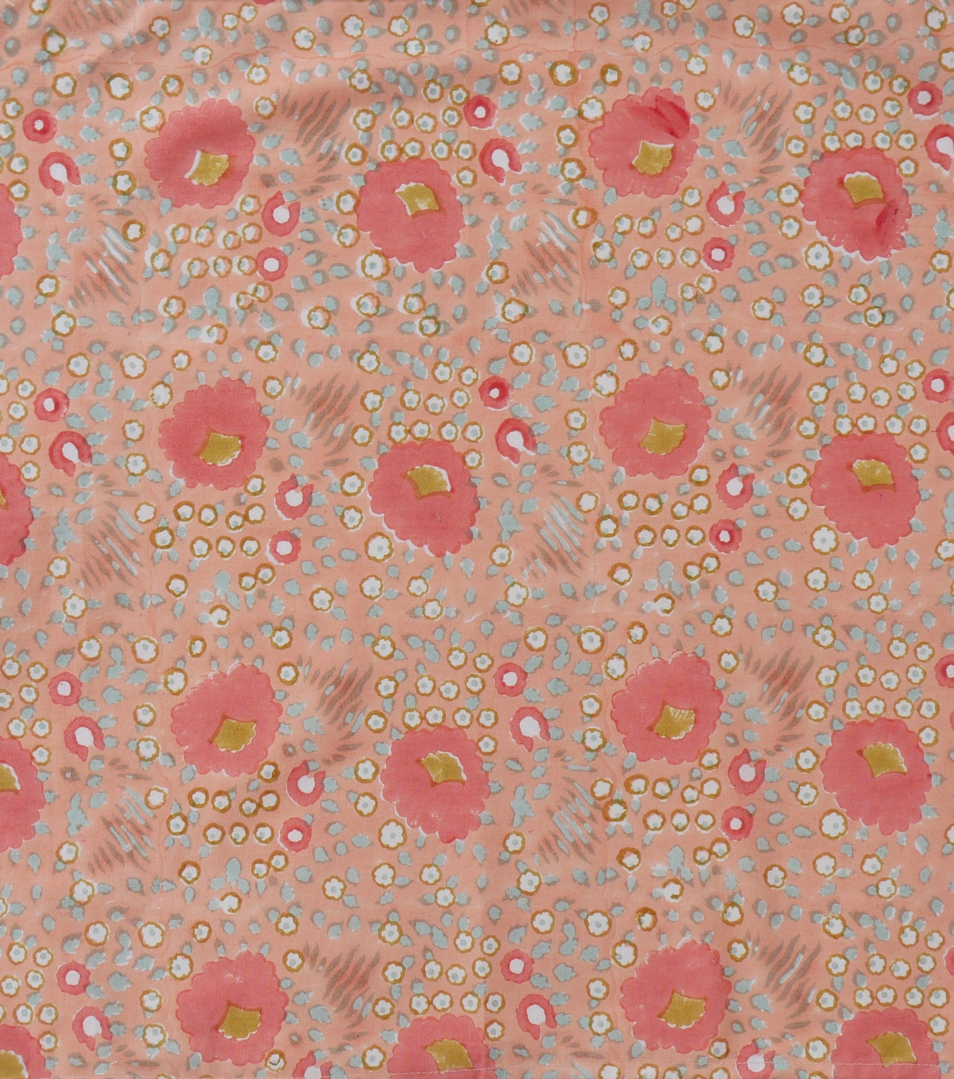 Patterned napkins with pink flowers and small white dots on a light pink background