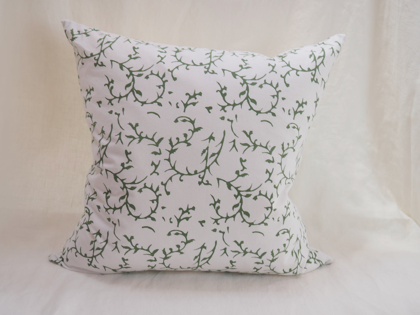 block printed cushion with feather pad
white background with green