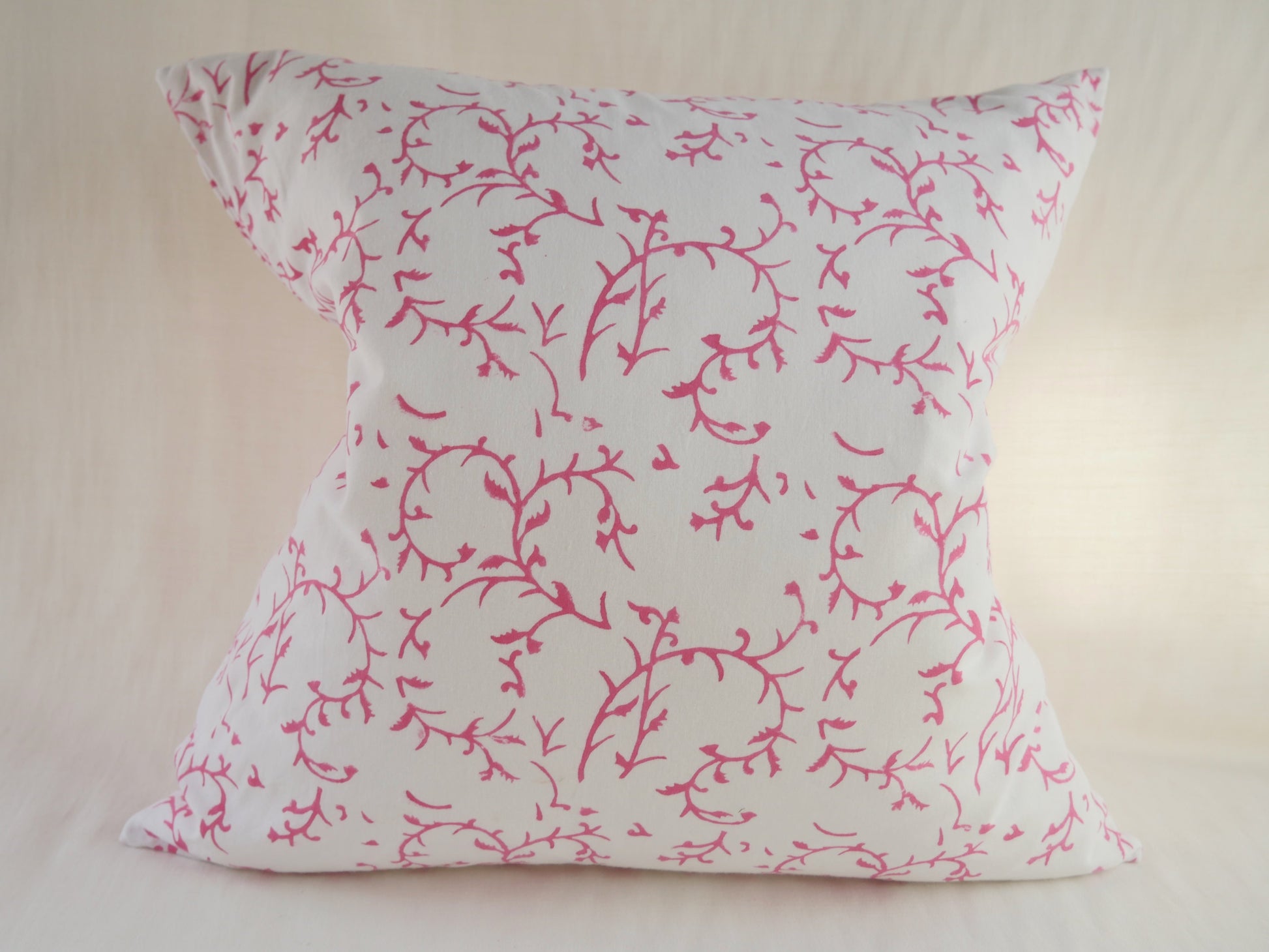 block printed cushion with feather pad
white background with pink