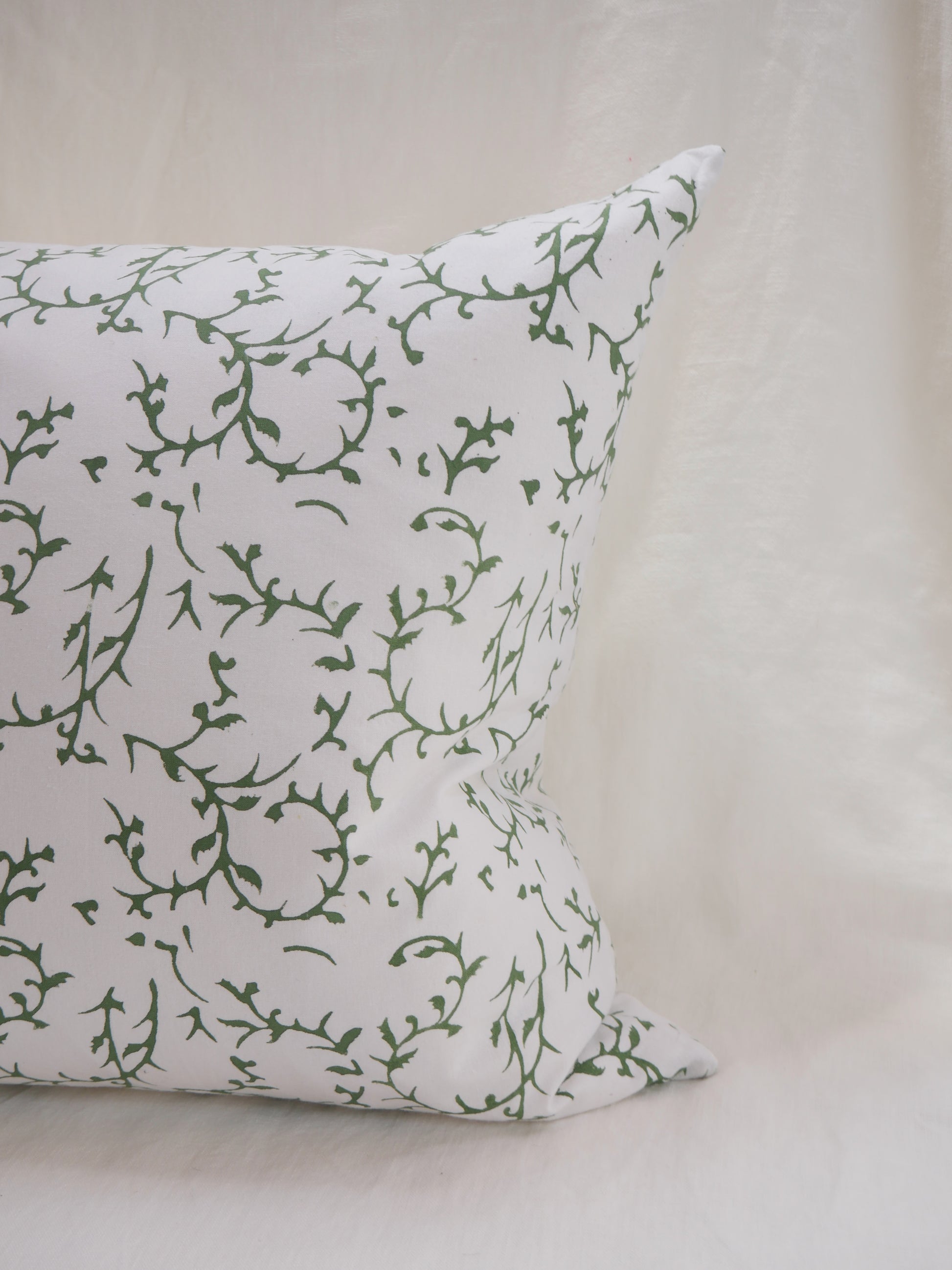 block printed cushion with feather pad
white background with green