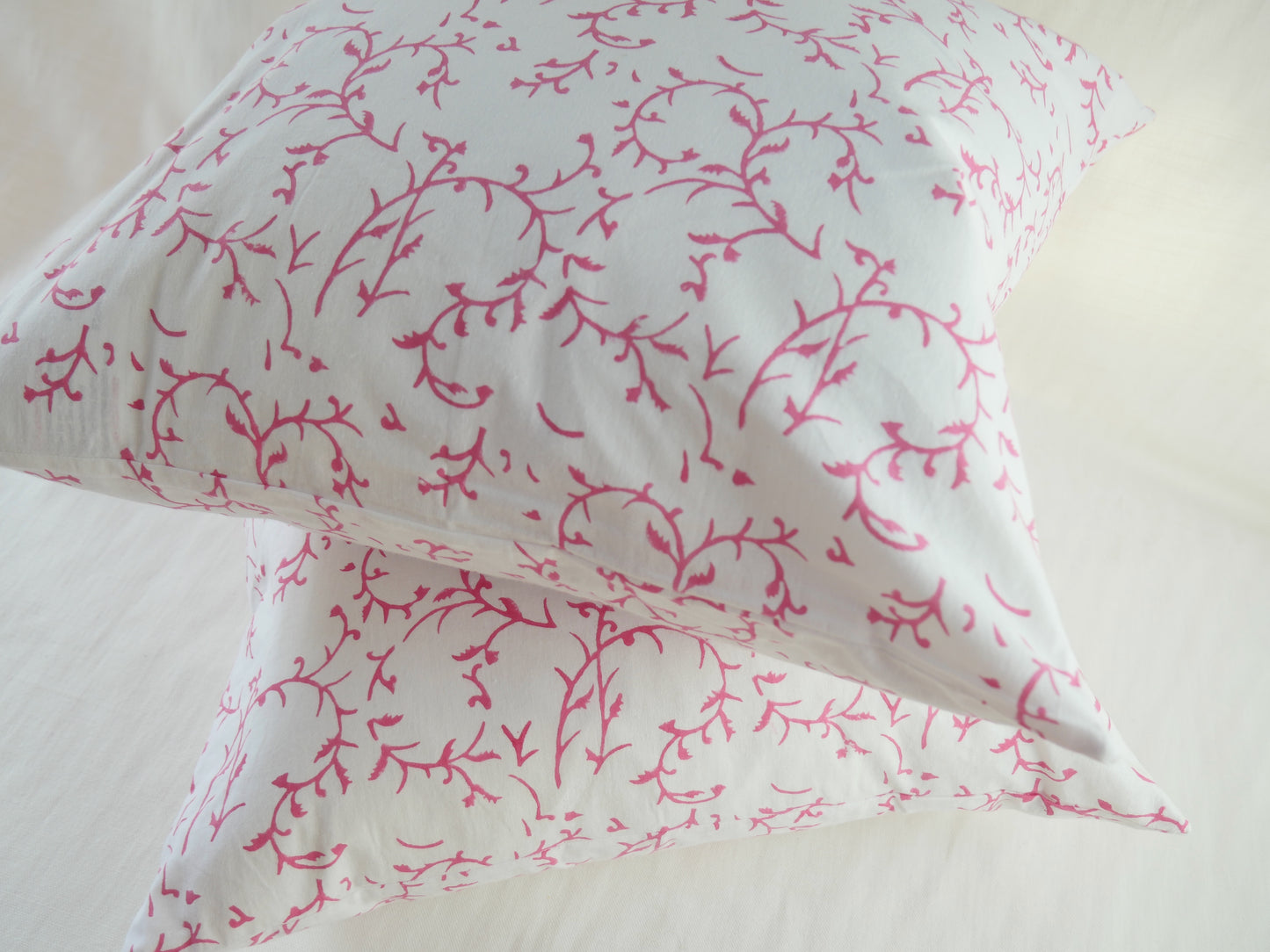 block printed cushion with feather pad
white background with pink