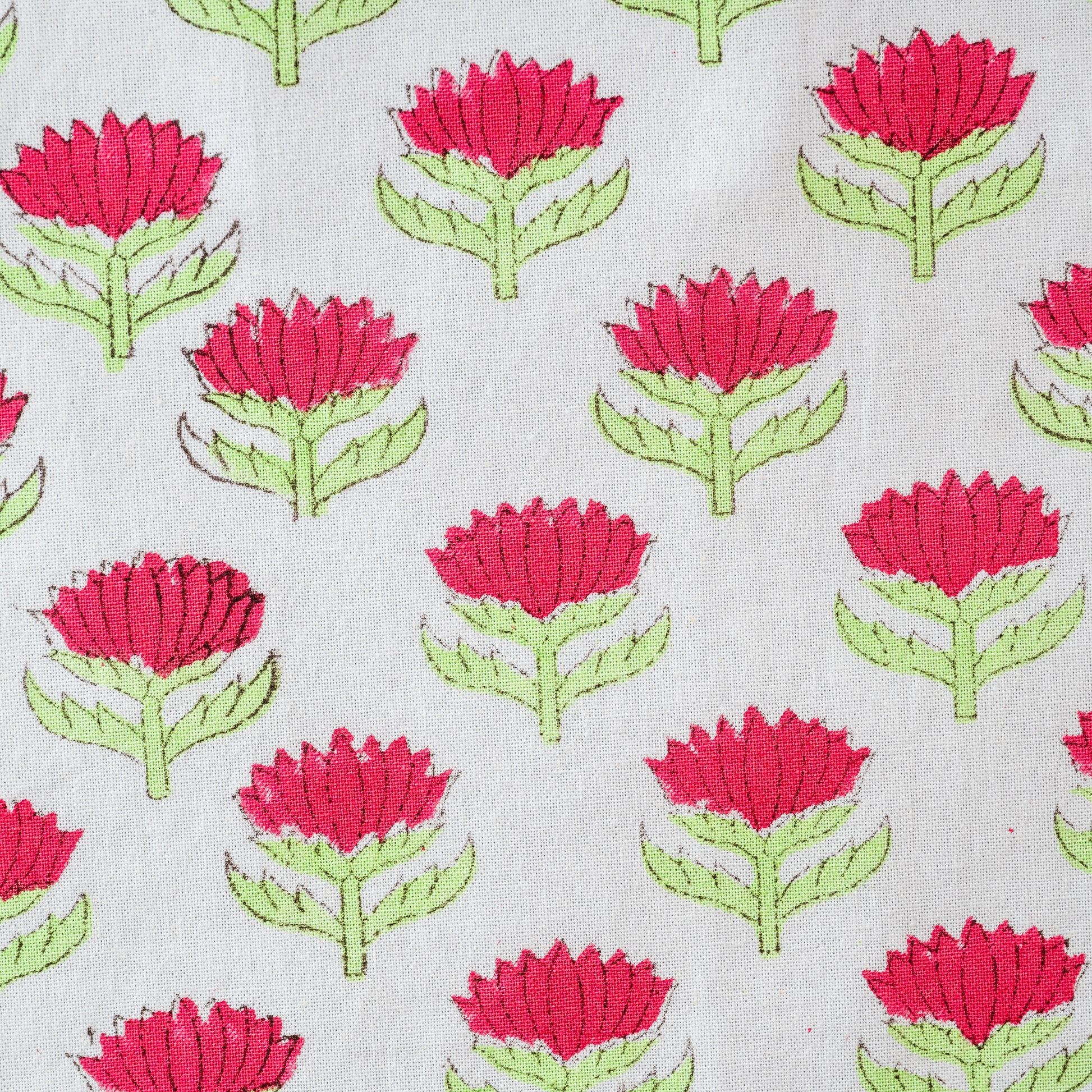 Pattern of red flowers with green stems on a light gray background. lotus-flower-napkins-block-printed-cherry-pink-green- set