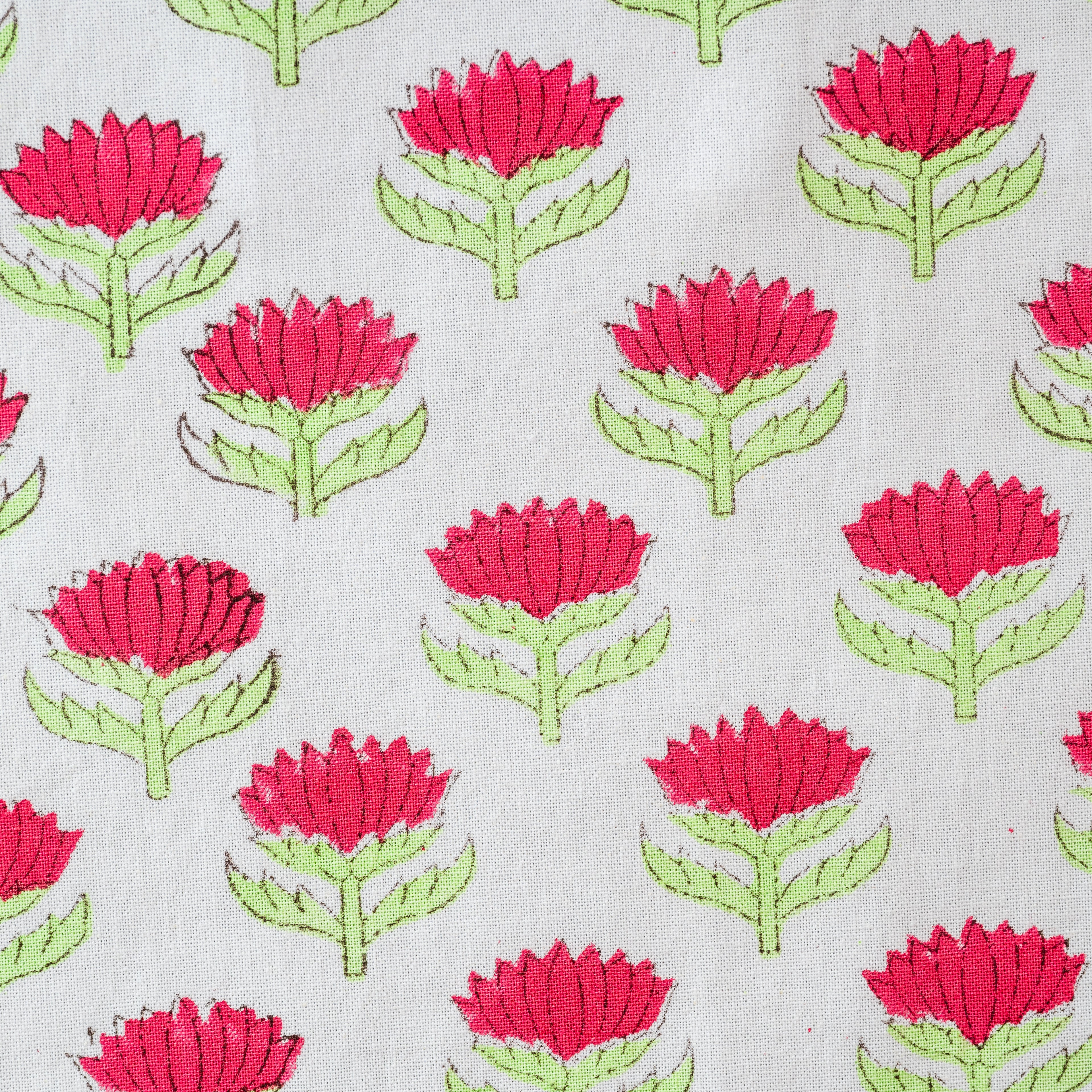 Pattern of red flowers with green stems on a light gray background. lotus-flower-napkins-block-printed-cherry-pink-green- set