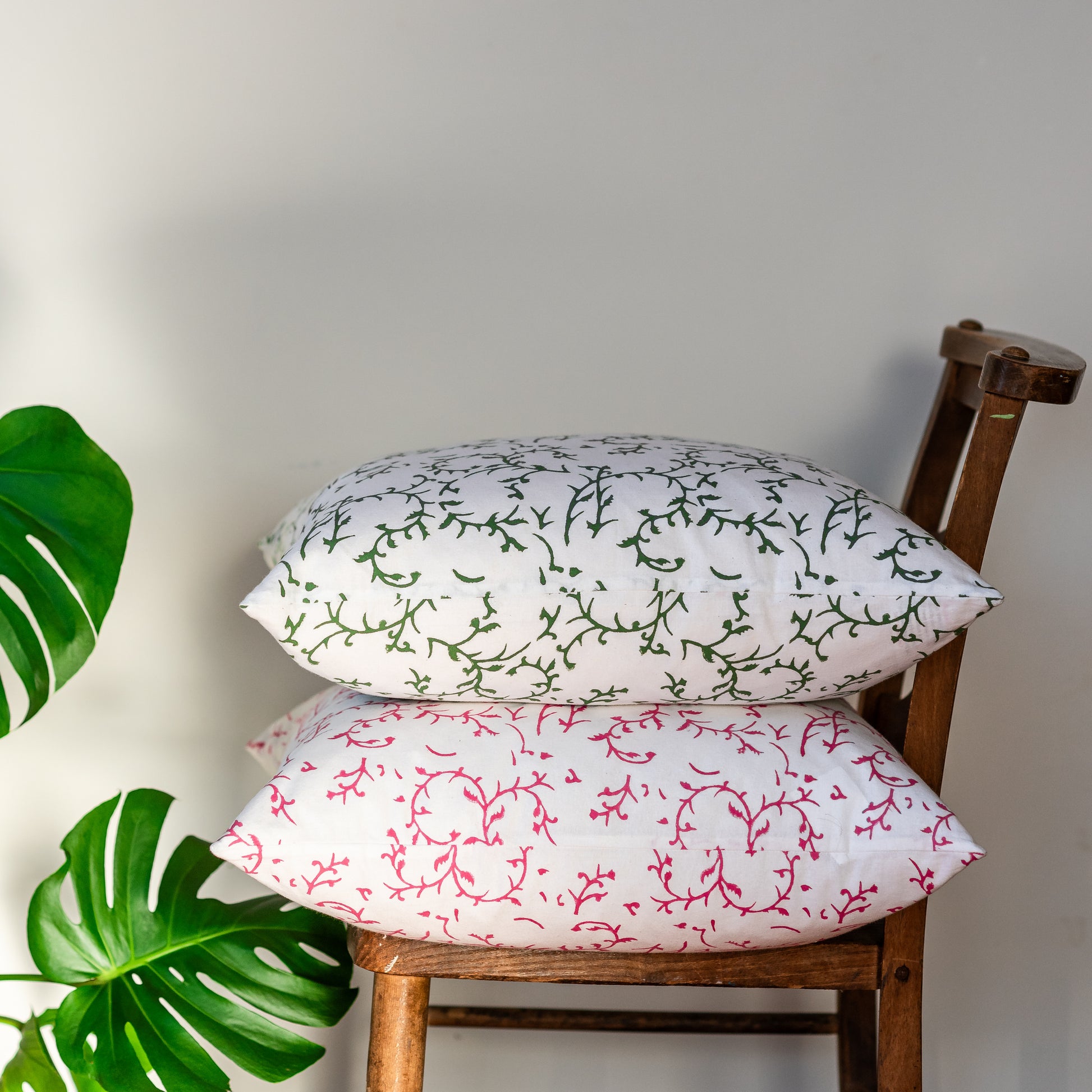 constance-and-denny-floral-green-block-printed-cushion-50x50-pink-pair-chair