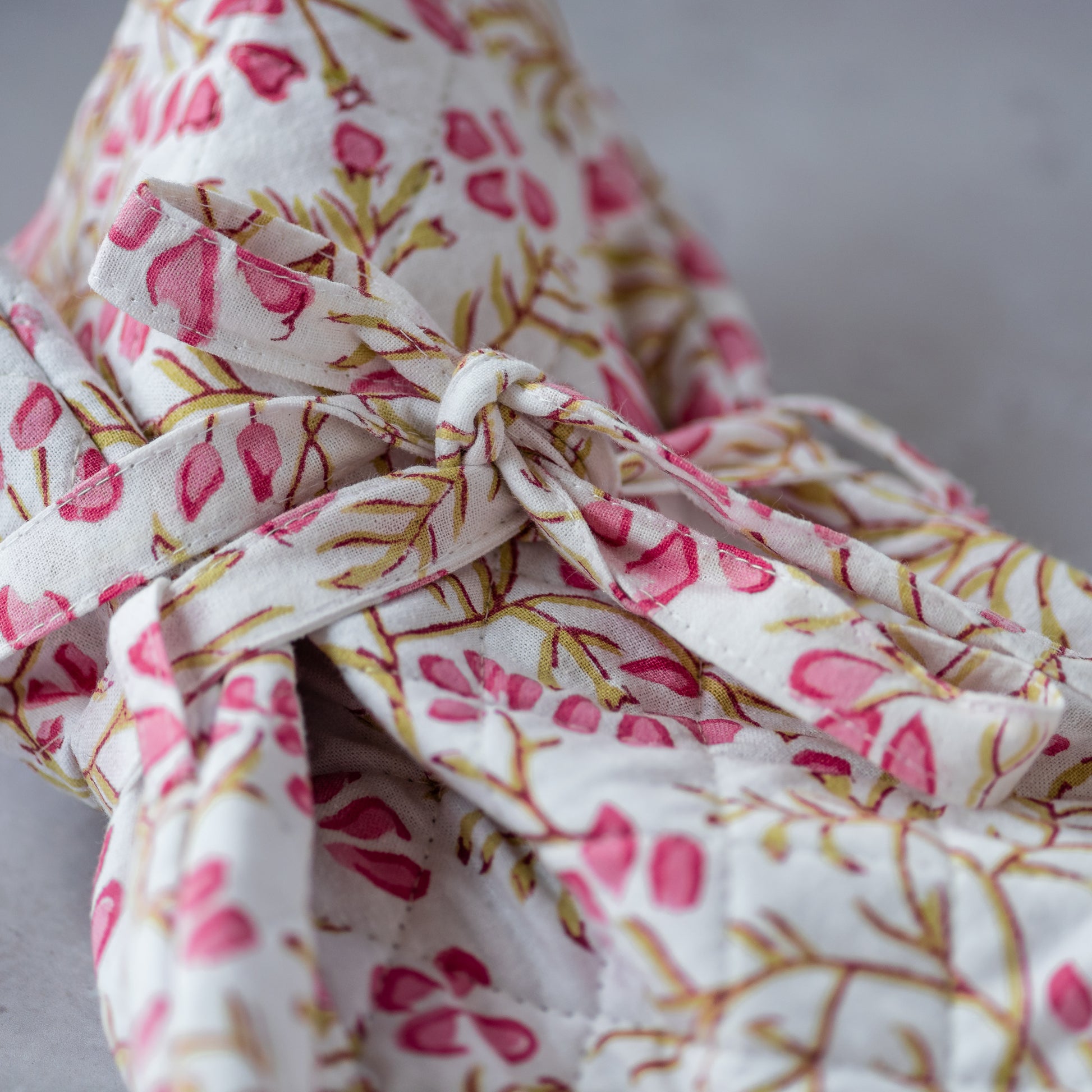 constance-and-denny-trailing-pink-hot-water-bottle-block-printed-detail