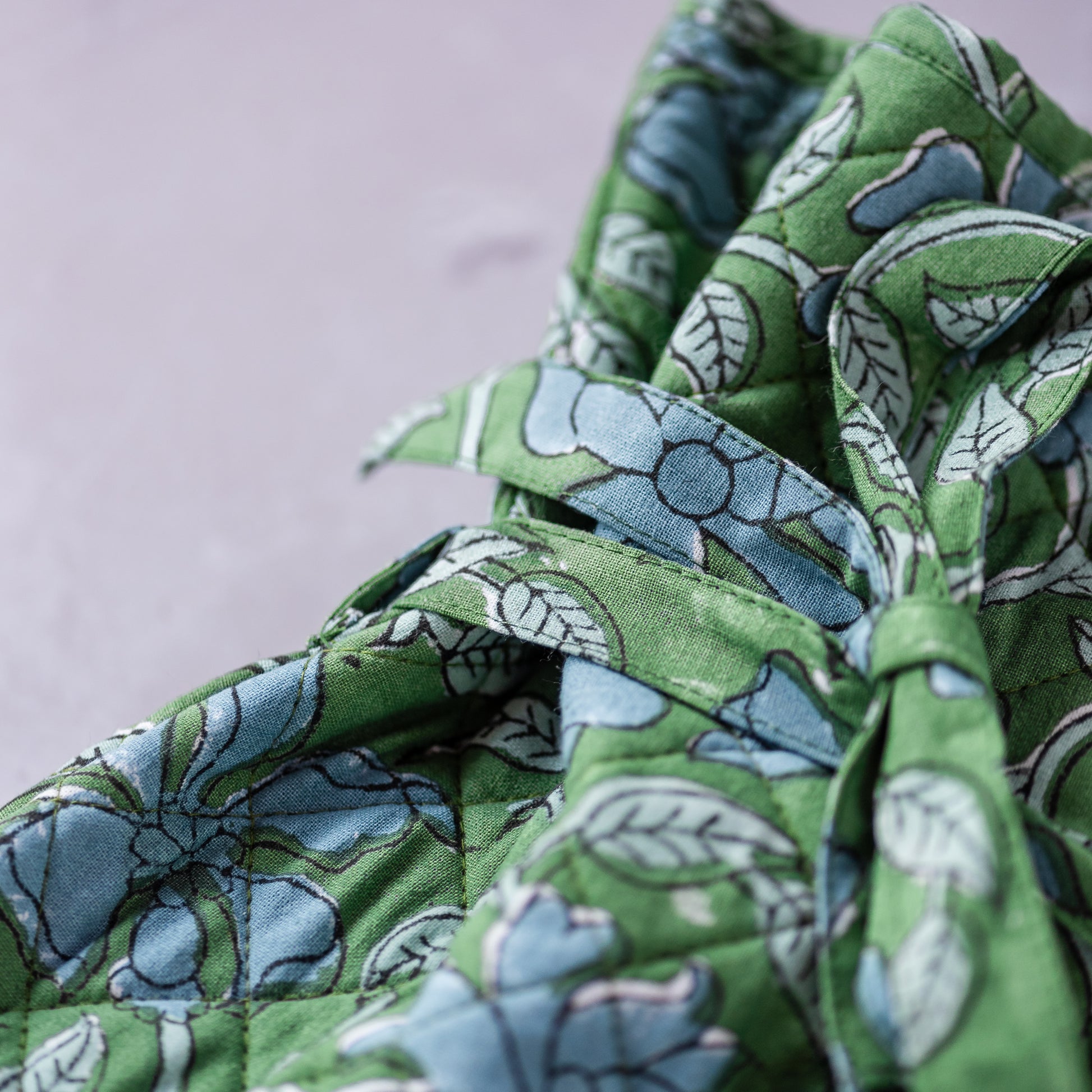 constance-and-denny-hot-water-bottle-blue-clematis-cosy-block-printed-detail