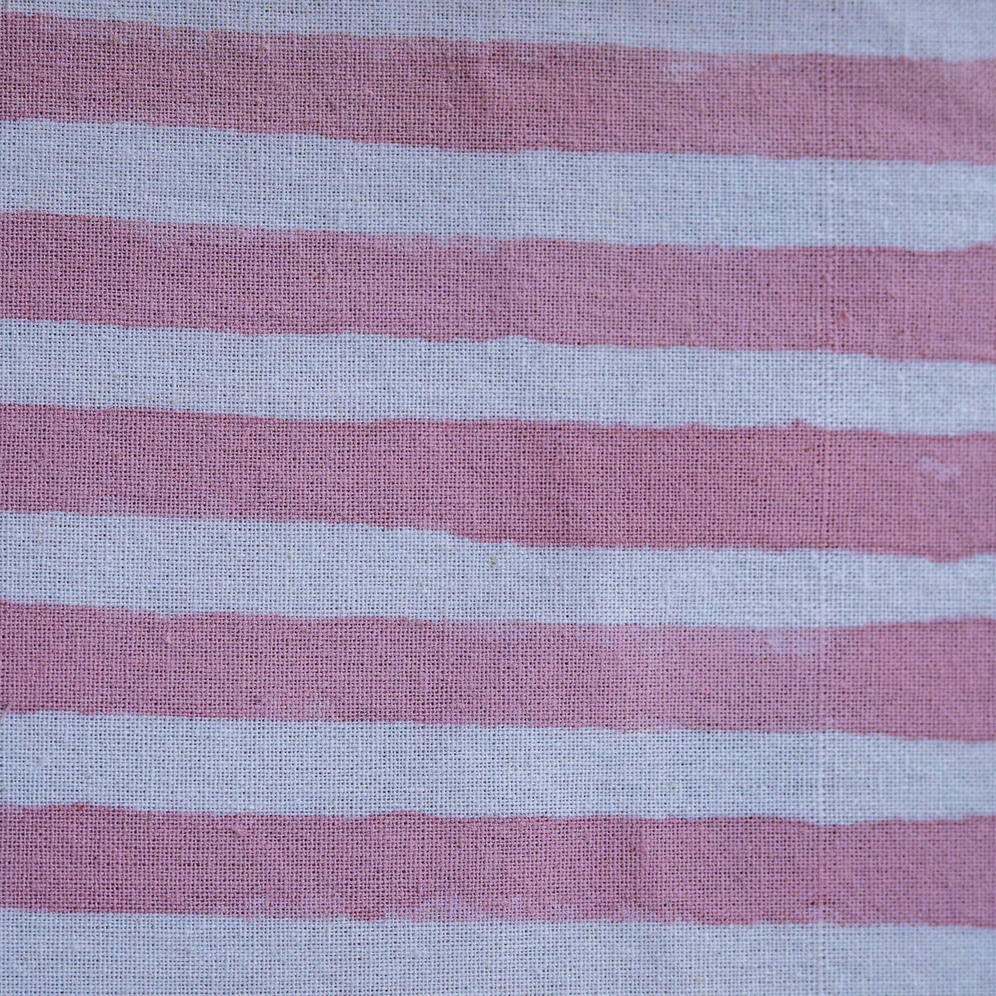 Close-up of fabric with pink and gray horizontal stripes
