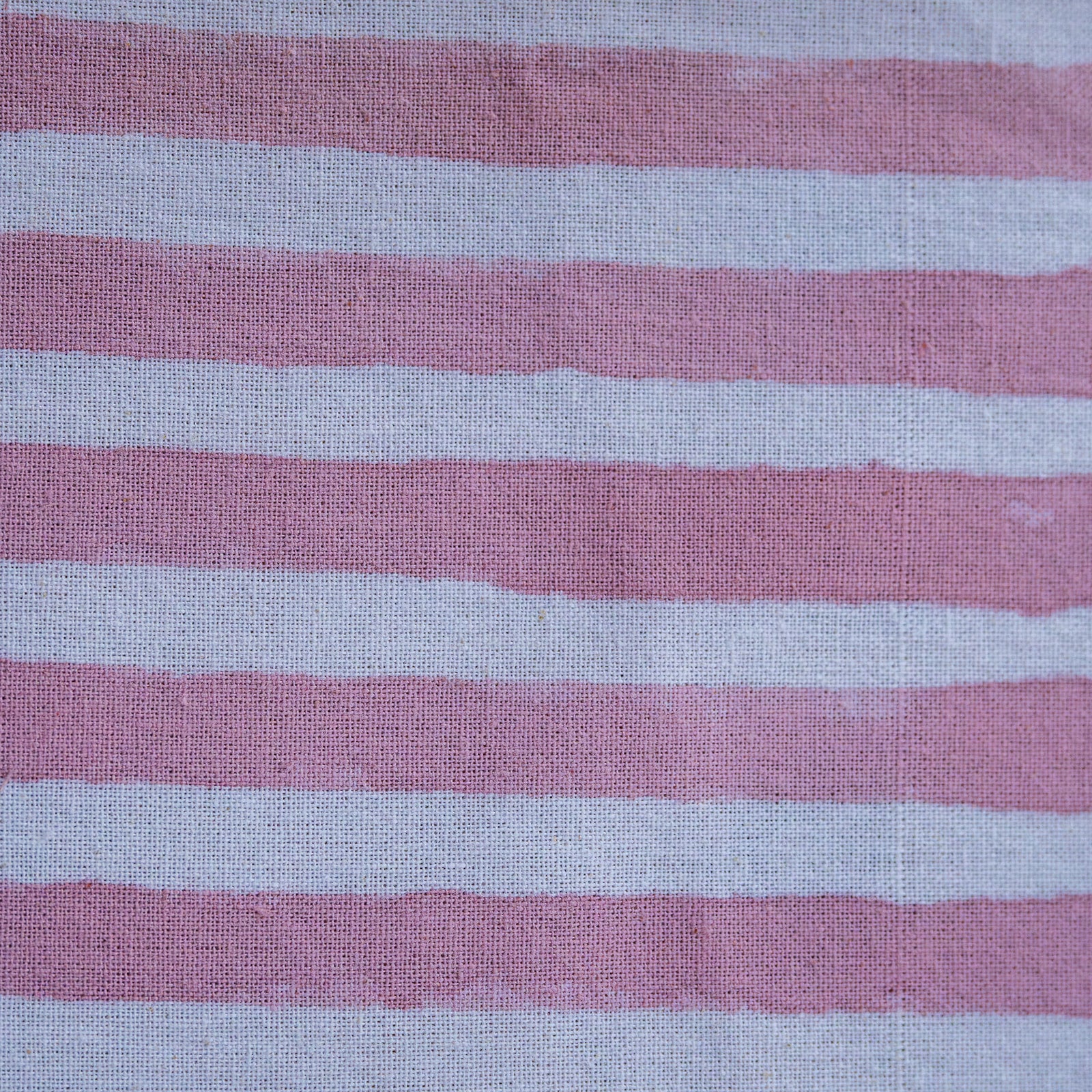 Close-up of fabric with pink and gray horizontal stripes