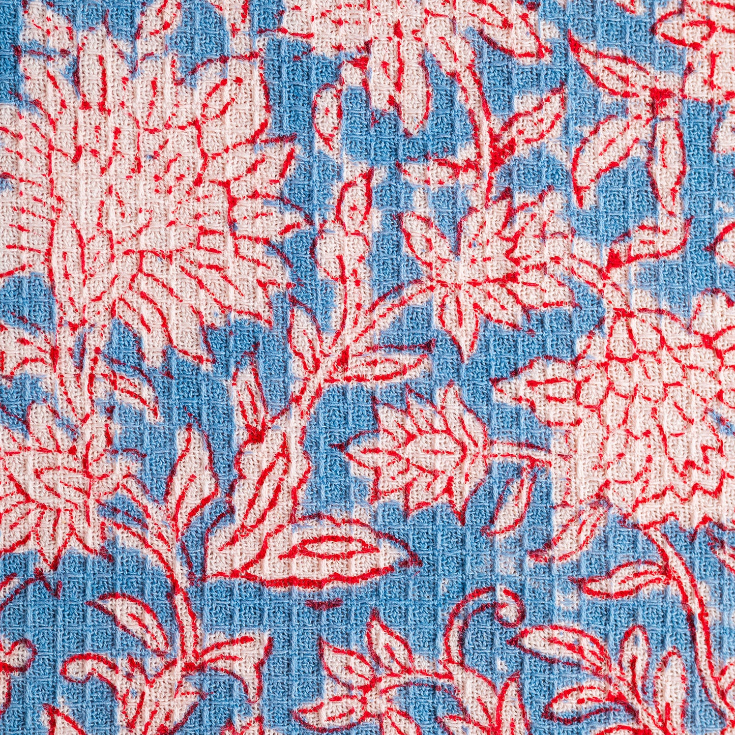 Floral pattern with red and white flowers on a blue background