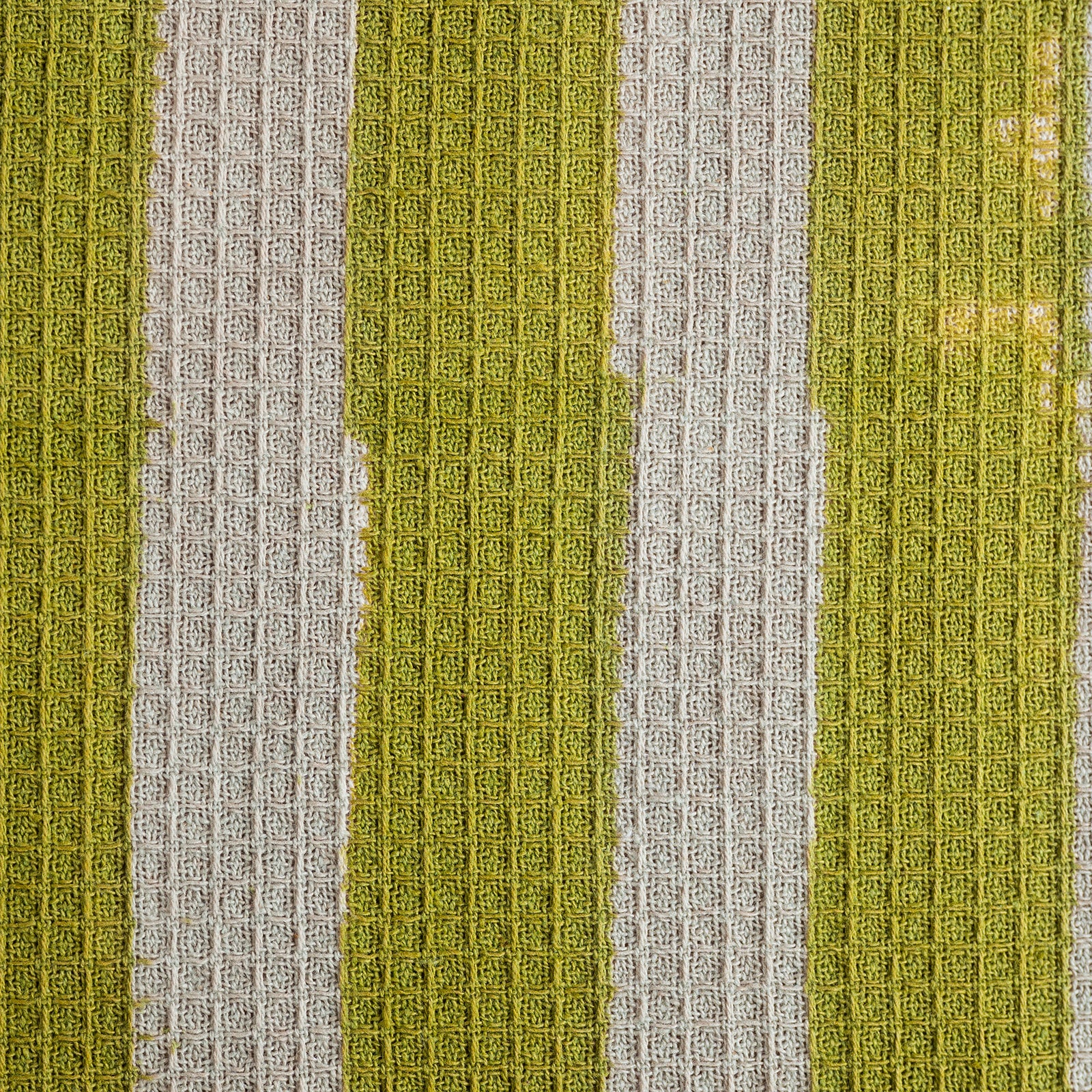 Textured fabric with green and gray vertical stripes