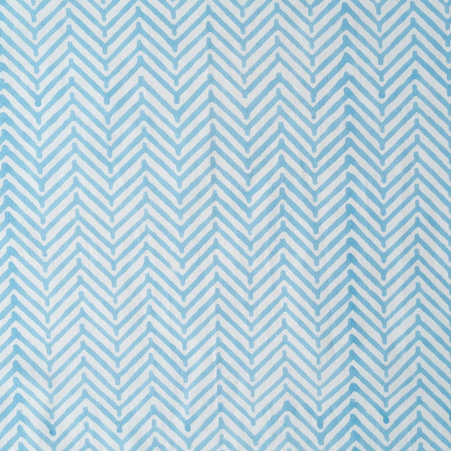 Pattern of blue and white chevron stripes on a blue background