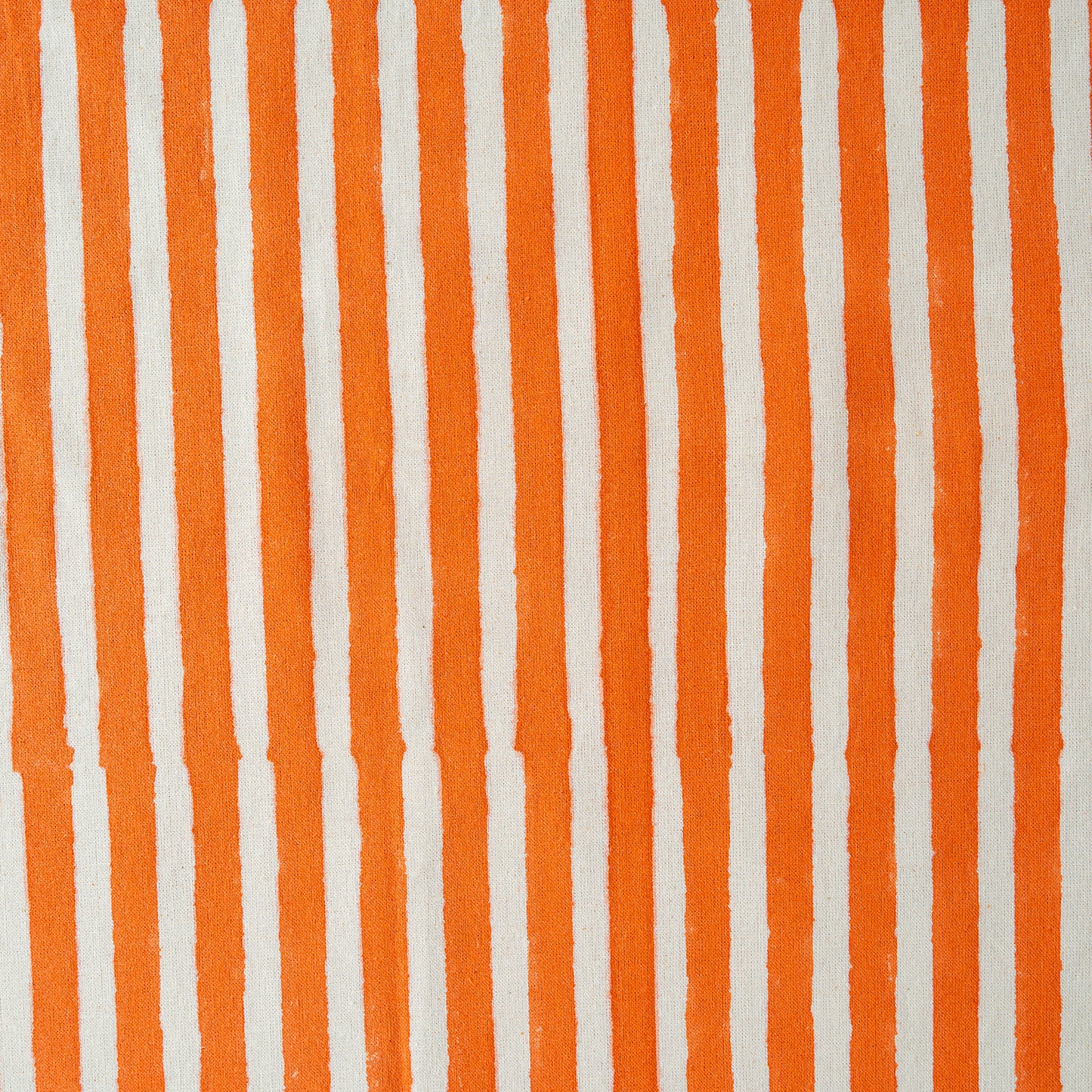 Pattern of vertical orange and white stripes on a textured background