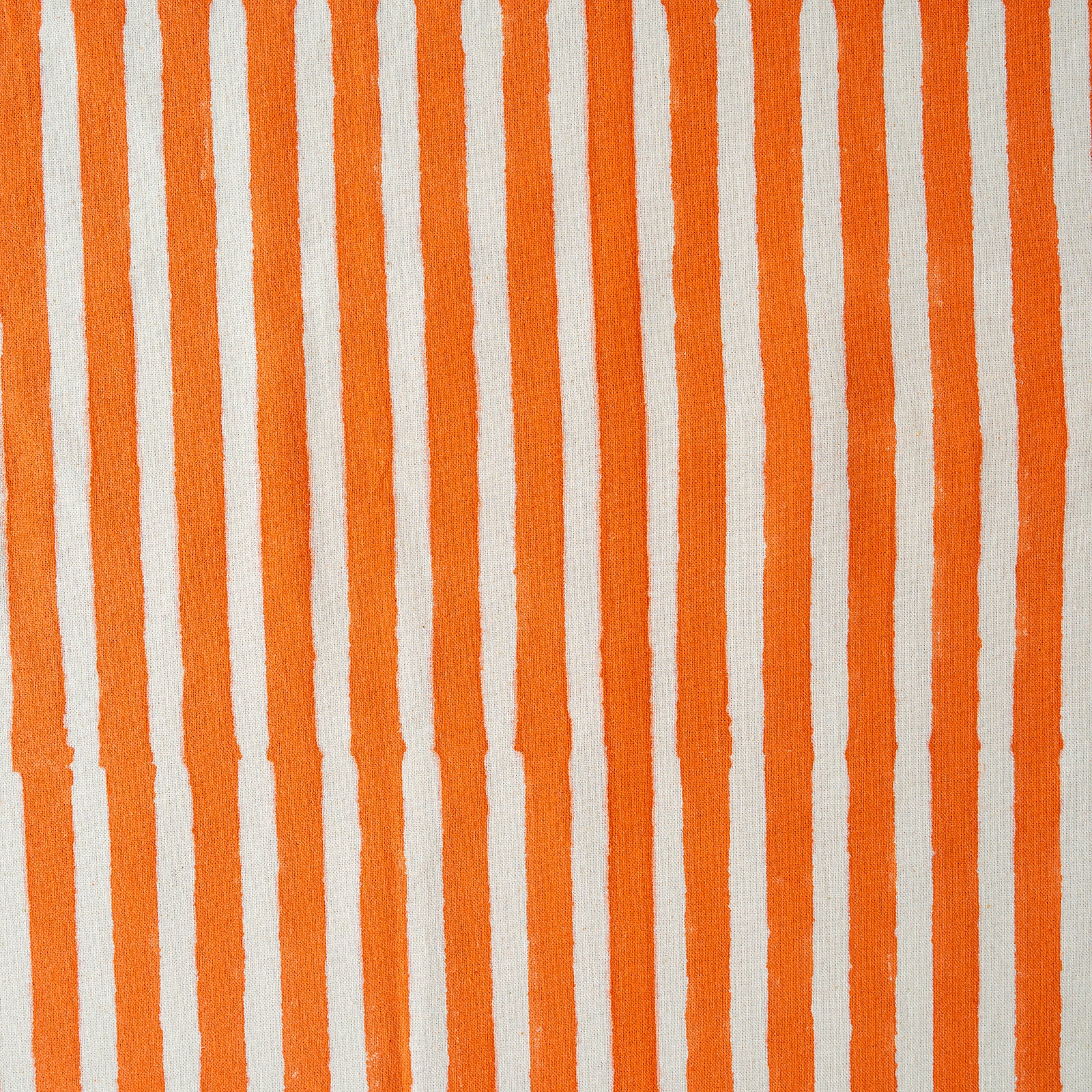 Pattern of vertical orange and white stripes on a textured background