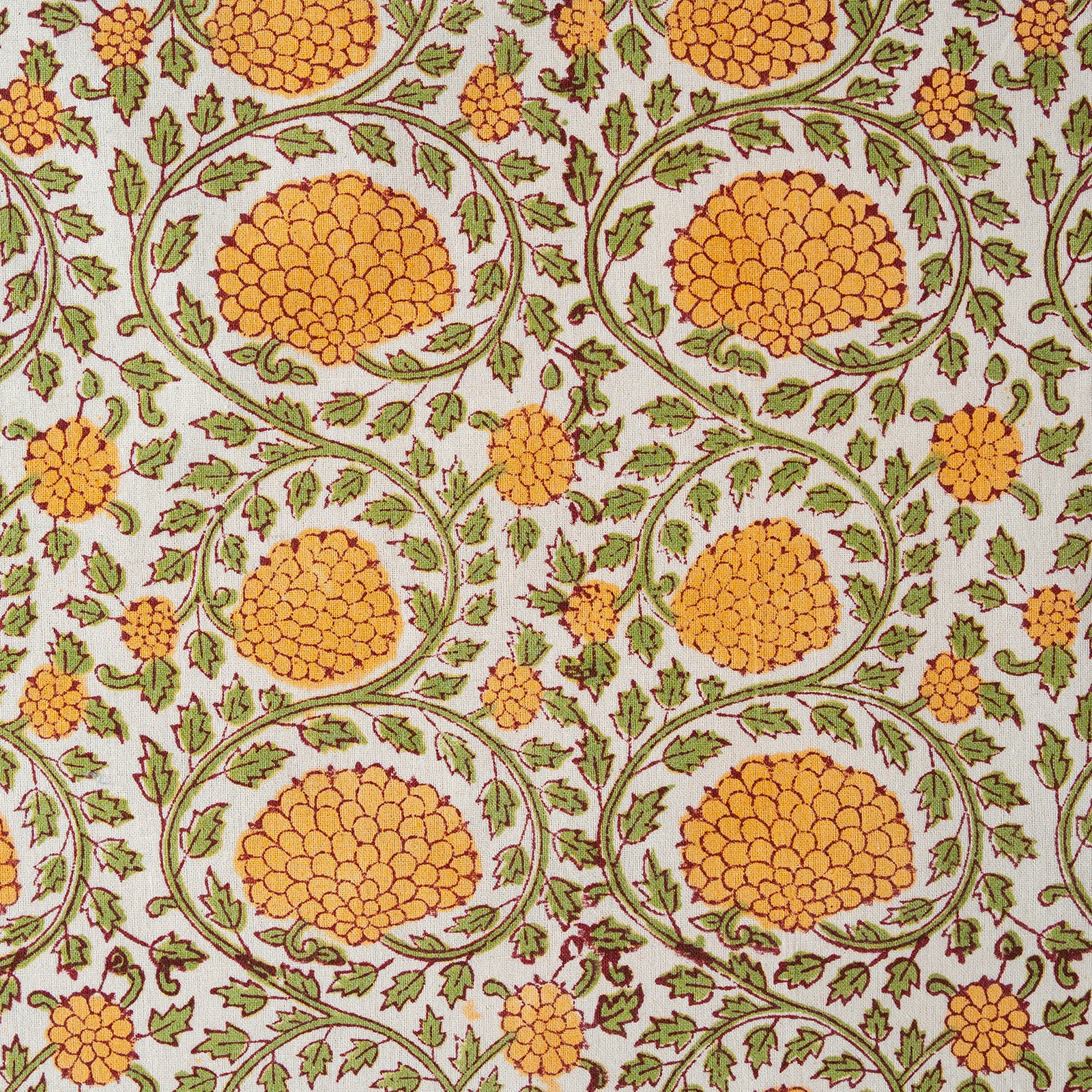 Patterned fabric with orange floral design on a white background