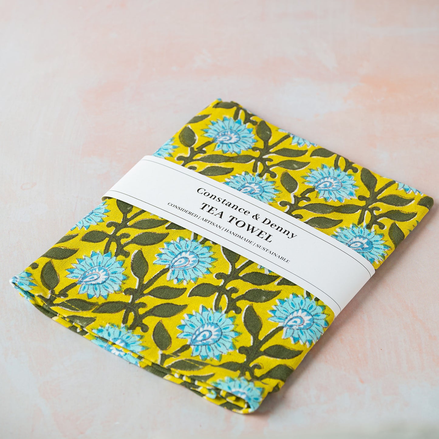 Tea towel with floral pattern on a light background