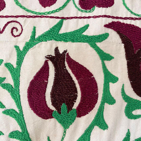 constance-and-denny-emerald-and-burgundy-suzani-detail