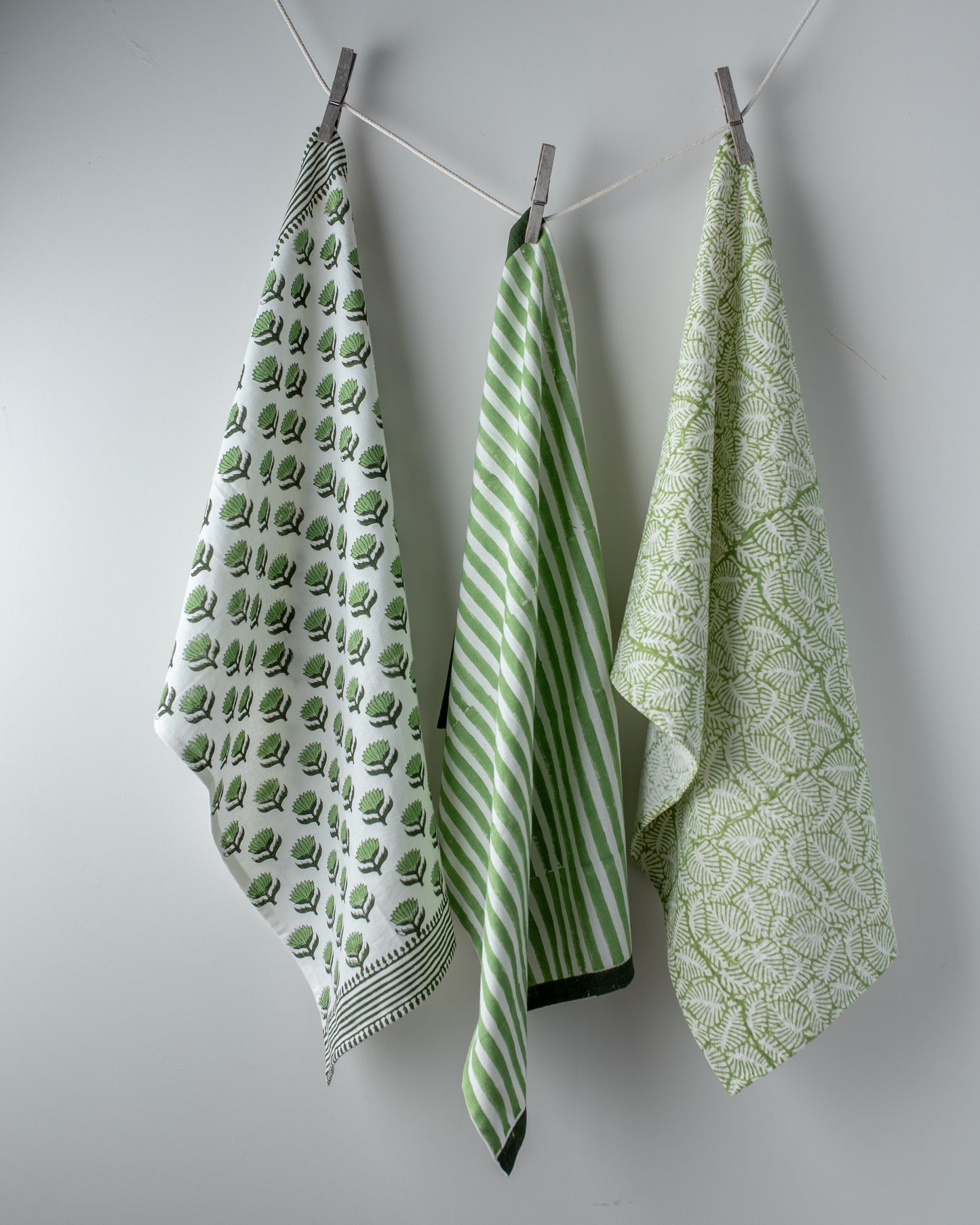 tea-towels-trio-green-block-printed-hanging