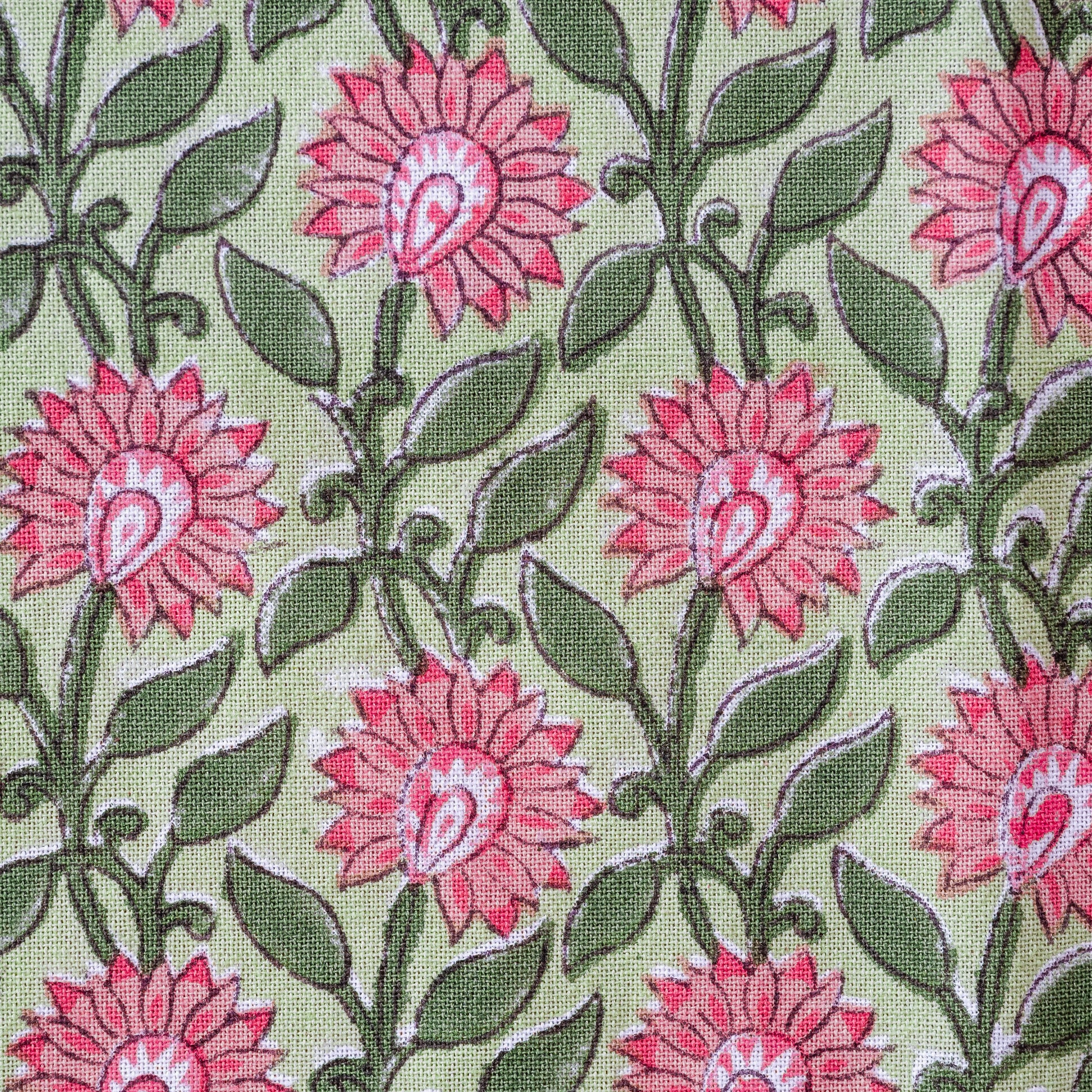 Pattern of pink flowers with green leaves on a light green background