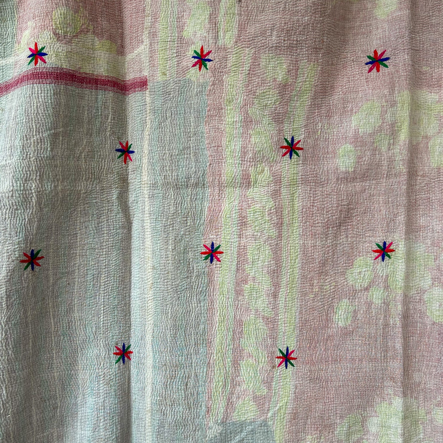Textile with colorful star patterns on a textured fabric background.  kantha-vintage-2035- hand-made-blanket-throw-textiles-wall-hanging