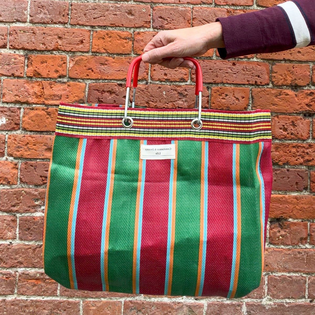 ruby and moss nylon bag, reclycled nylon plastic bag with colourful metal handle