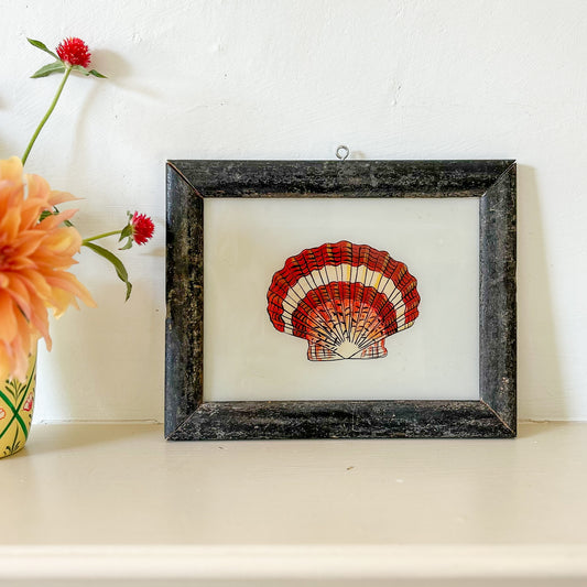 Framed artwork of a red shell on a white background with flowers to the side. constance-and-denny-indian-reverse-glass-painting-boxed-packaging-hand-painted-artisan-art- shell